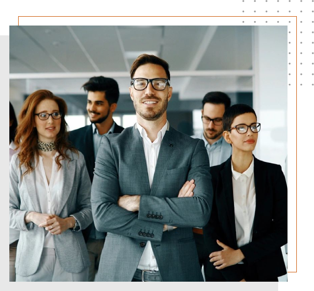 A group of people standing in an office.